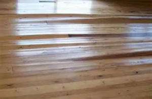 Real water damage on hardwood flooring in Sun City Summerlin Las Vegas caused by a leak.