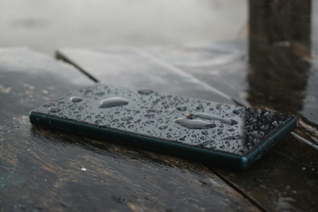 Smartphone used to document water damage before cleanup