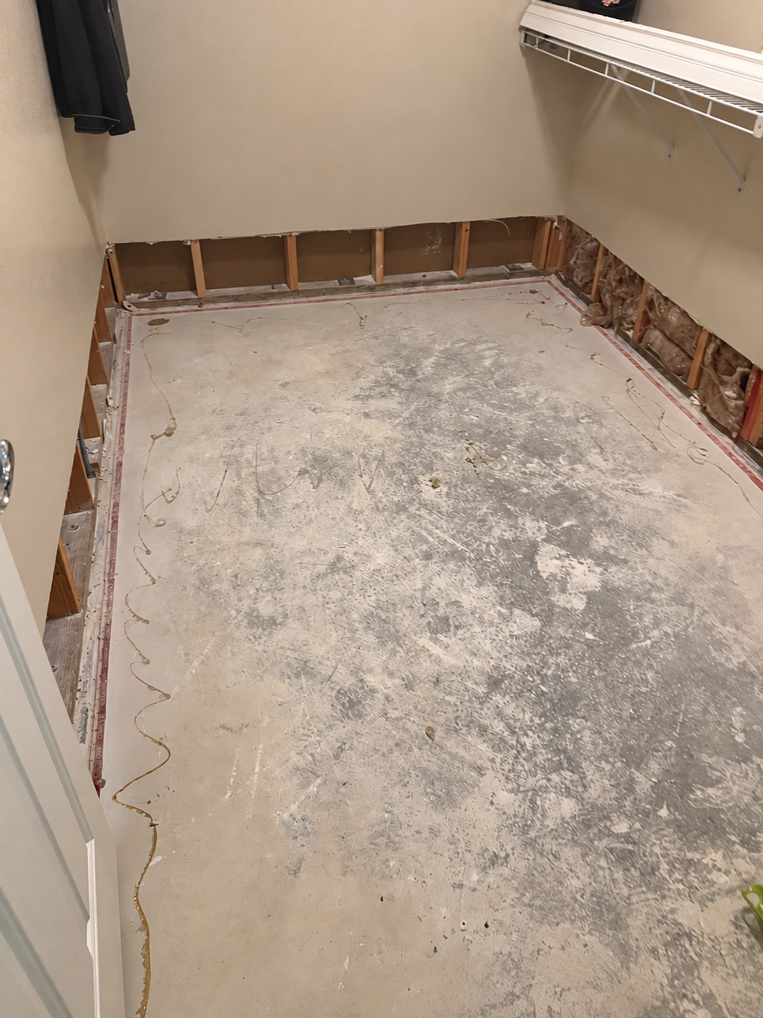 Water damage closet demolition with damaged drywall removed for restoration in Las Vegas