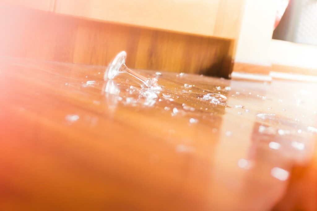 Water on a wood surface showing hidden flooring moisture risk