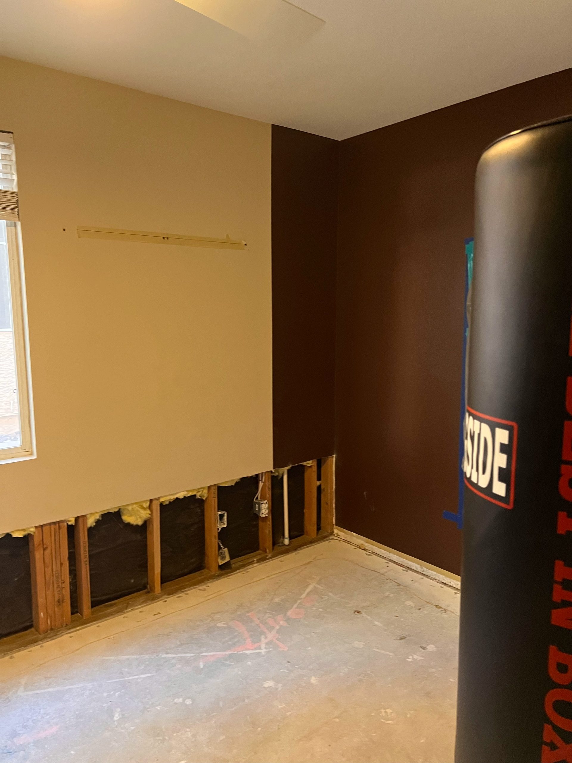 Room framing and ceiling exposed before water damage repairs